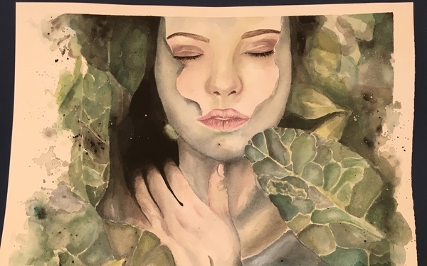 A watercolor painting on white paper depicting a female figure with closed eyes, surrounded by and merging with lush green foliage. The figure's pale skin contrasts with the green and yellow leaves, and her hands are raised near her face and chest. The artwork blends the human form with nature in a dreamlike, ethereal style.