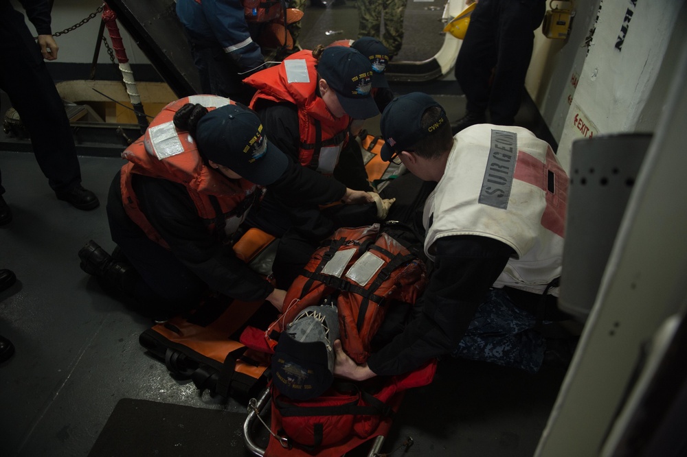 Sailors conduct man overboard drill