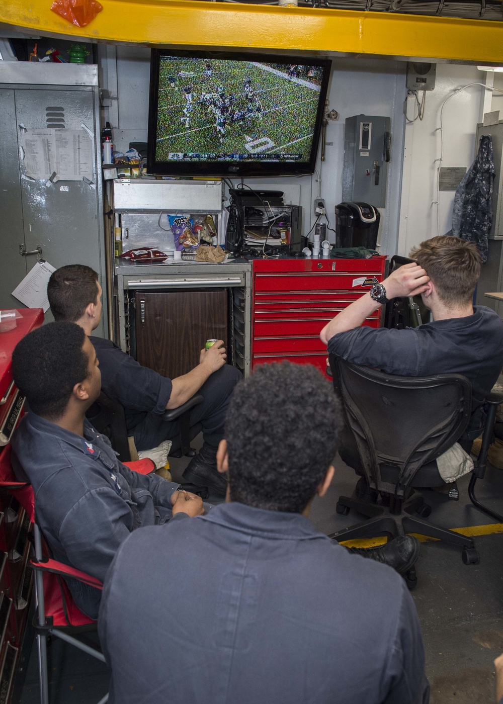 Sailors and Marines aboard USS Bonhomme Richard (LHD 6) watch Superbowl LII