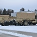 Military vehicles staged for rail movement from Fort McCoy