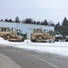Military vehicles staged for rail movement from Fort McCoy