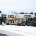 Military vehicles staged for rail movement from Fort McCoy