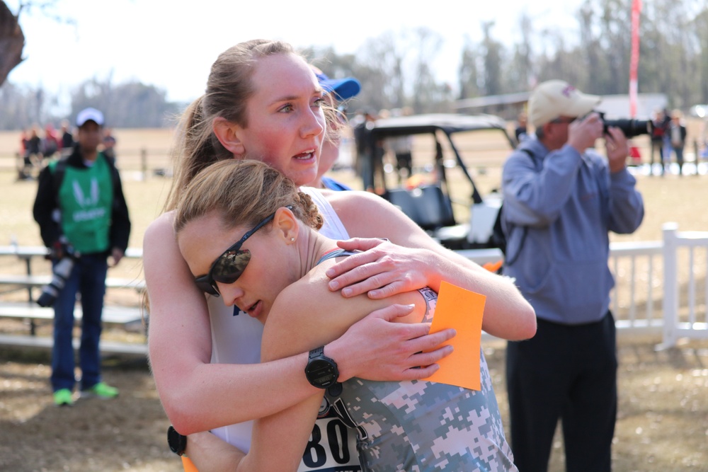 Air Force 2nd lt. Hannah Everson of Hurlburt Field, Florida and Army Maj. Kelly Calway of West Point, N.Y., congratulate each other after finishing 2nd and 3rd respectively during the 2018 Armed Forces Cross Country Championship in Tallahassee, Florida,