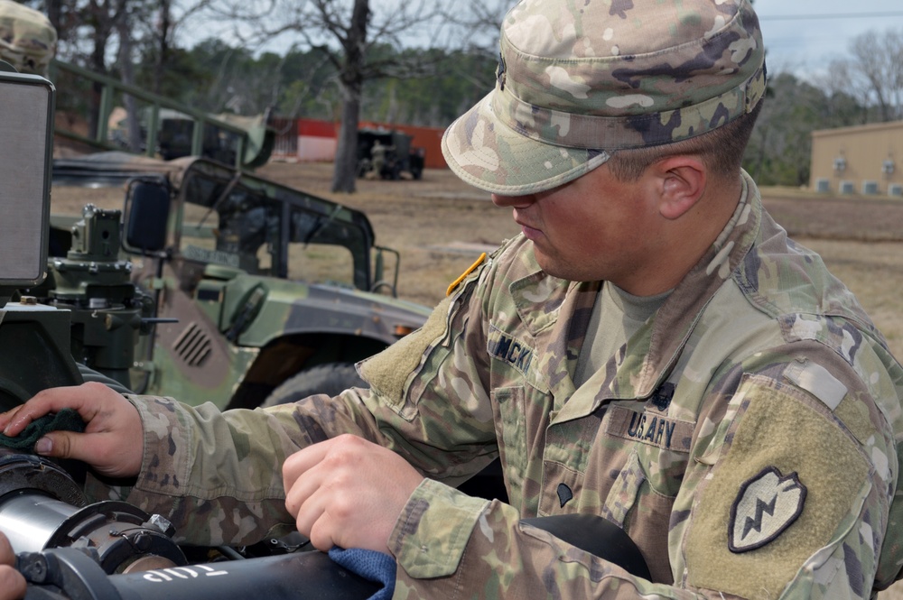 Cannon crewmembers prep howitzer for JRTC