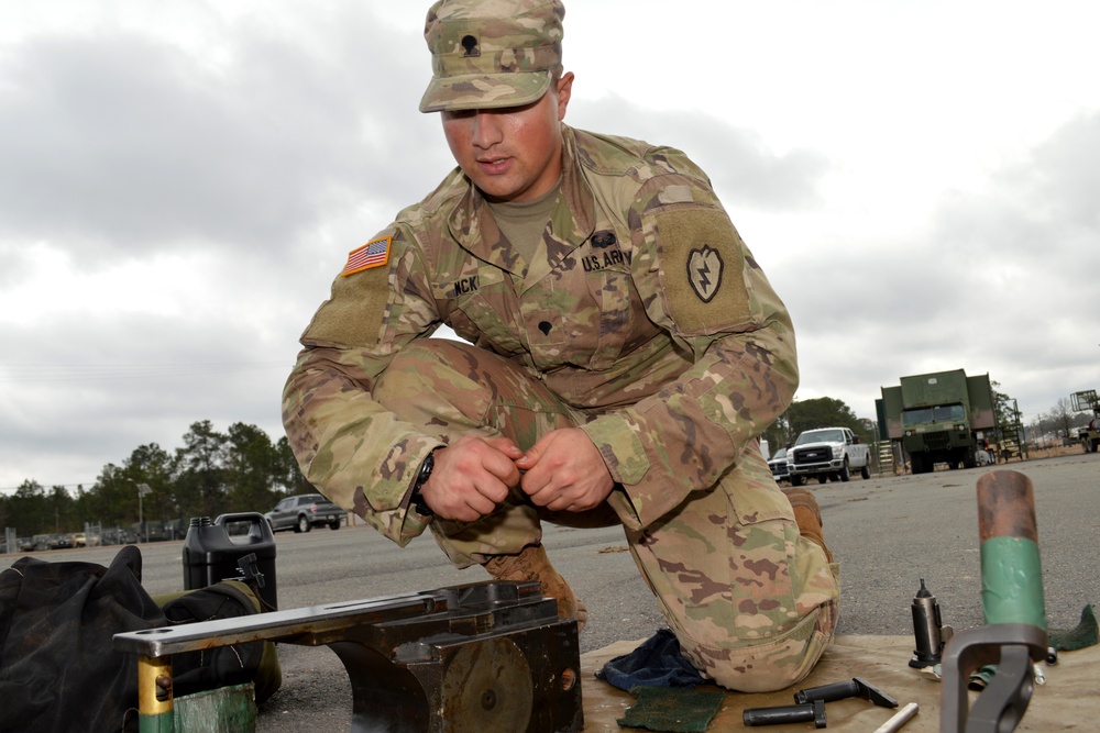 Cannon crewmembers prep howitzer for JRTC