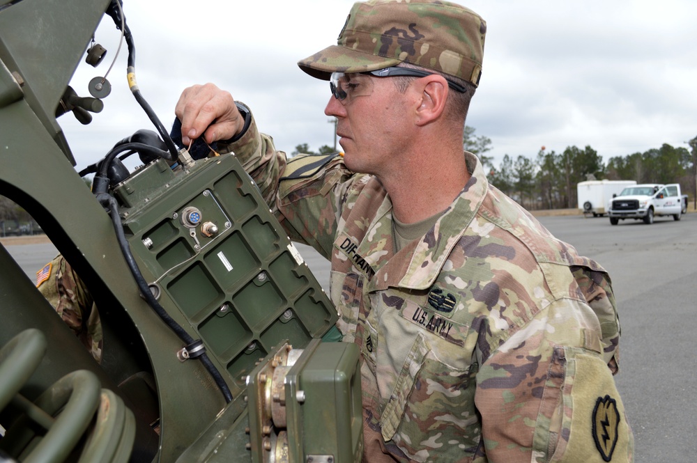 Cannon crewmembers prep howitzer for JRTC