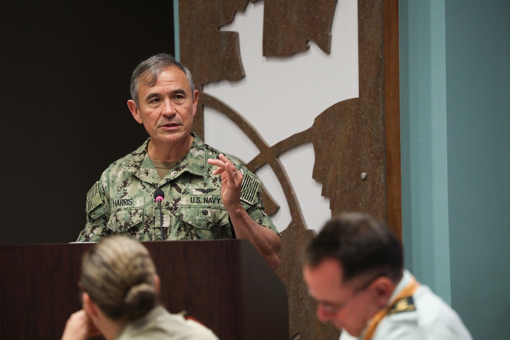 Admiral Harris, Commander USPACOM, visits Asia Pacific Center for Secuity Studies and talks to members of a small workshop.