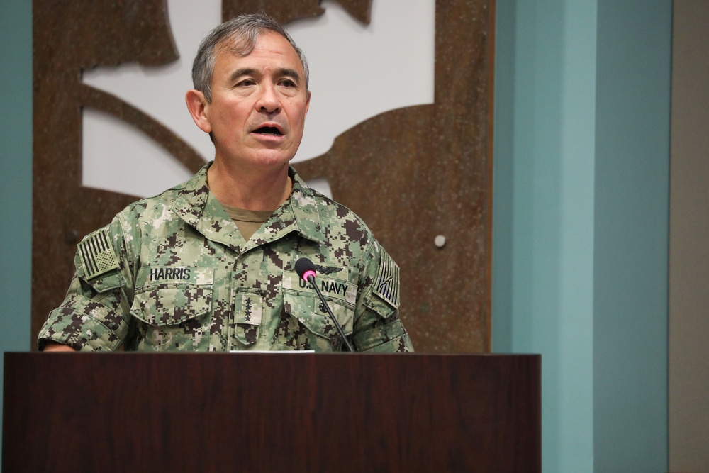 Admiral Harris, Commander USPACOM, visits Asia Pacific Center for Security Studies and talks to members of a small workshop.