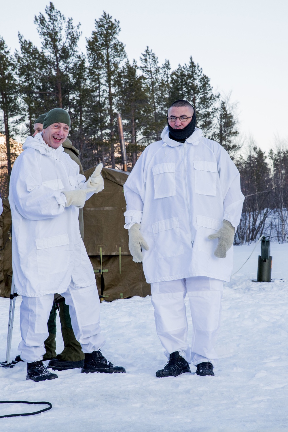 Norwegian and U.S. generals and sergeants major conduct an ice-breaking drill