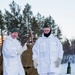 Norwegian and U.S. generals and sergeants major conduct an ice-breaking drill