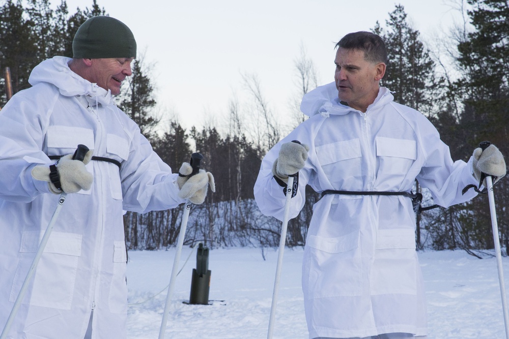 Norwegian and U.S. generals and sergeants major conduct an ice-breaking drill