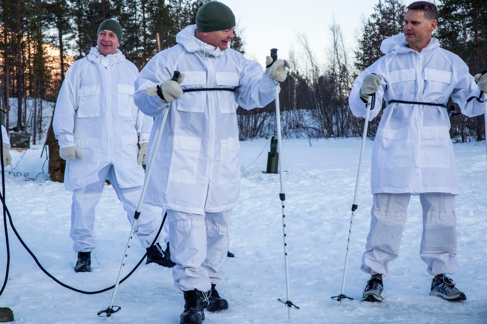 Norwegian and U.S. generals and sergeants major conduct an ice-breaking drill