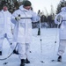 Norwegian and U.S. generals and sergeants major conduct an ice-breaking drill