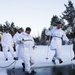 Norwegian and U.S. generals and sergeants major conduct an ice-breaking drill