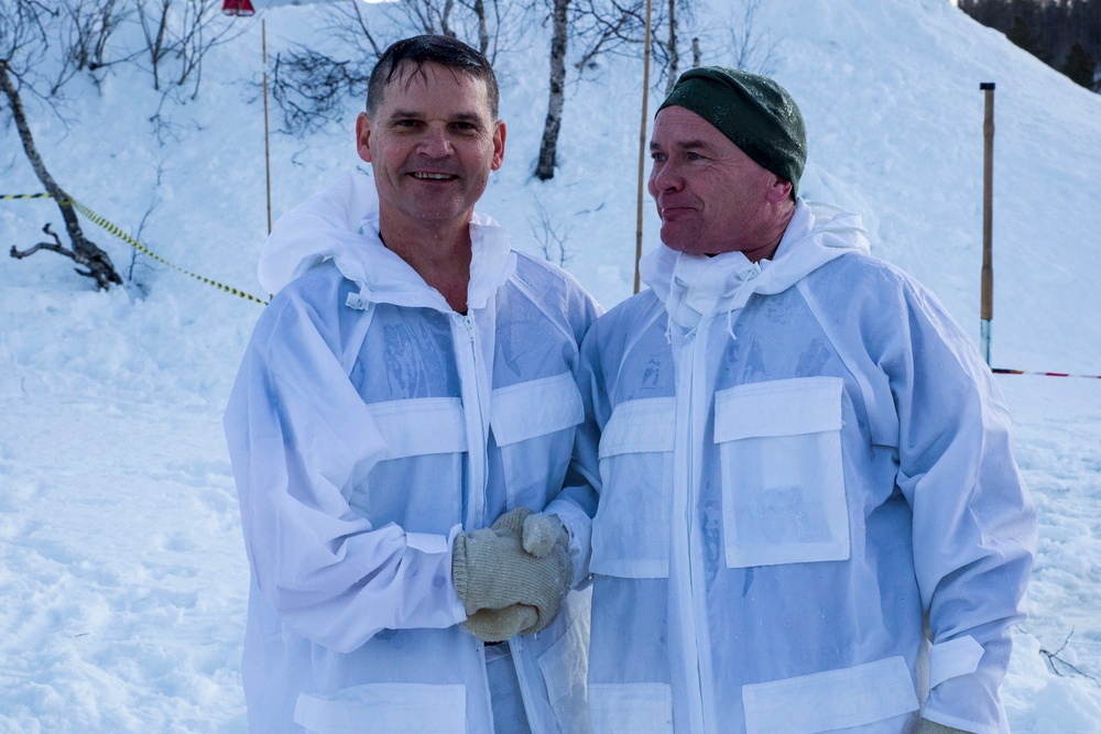 Norwegian and U.S. generals and sergeants major conduct an ice-breaking drill