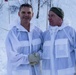 Norwegian and U.S. generals and sergeants major conduct an ice-breaking drill