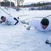 Norwegian and U.S. generals and sergeants major conduct an ice-breaking drill