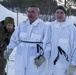 Norwegian and U.S. generals and sergeants major conduct an ice-breaking drill