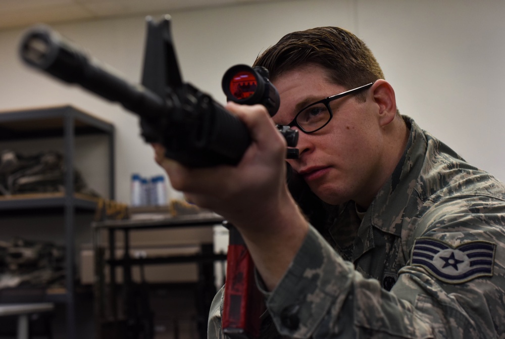 Combat arms help Airmen sharpen sights on readiness