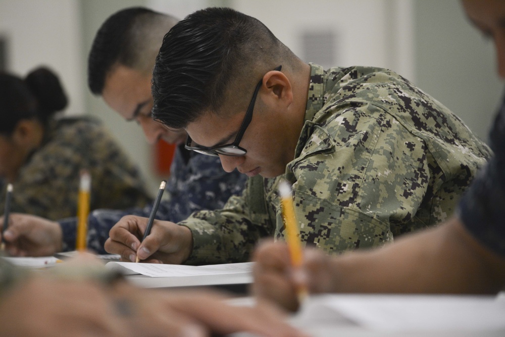 A reserve Sailor assigned to Navy Operational Support Center (NOSC) Los Angeles participates in the January E-4 to E-7 advancement exams in the drill hall at NOSC Los Angeles