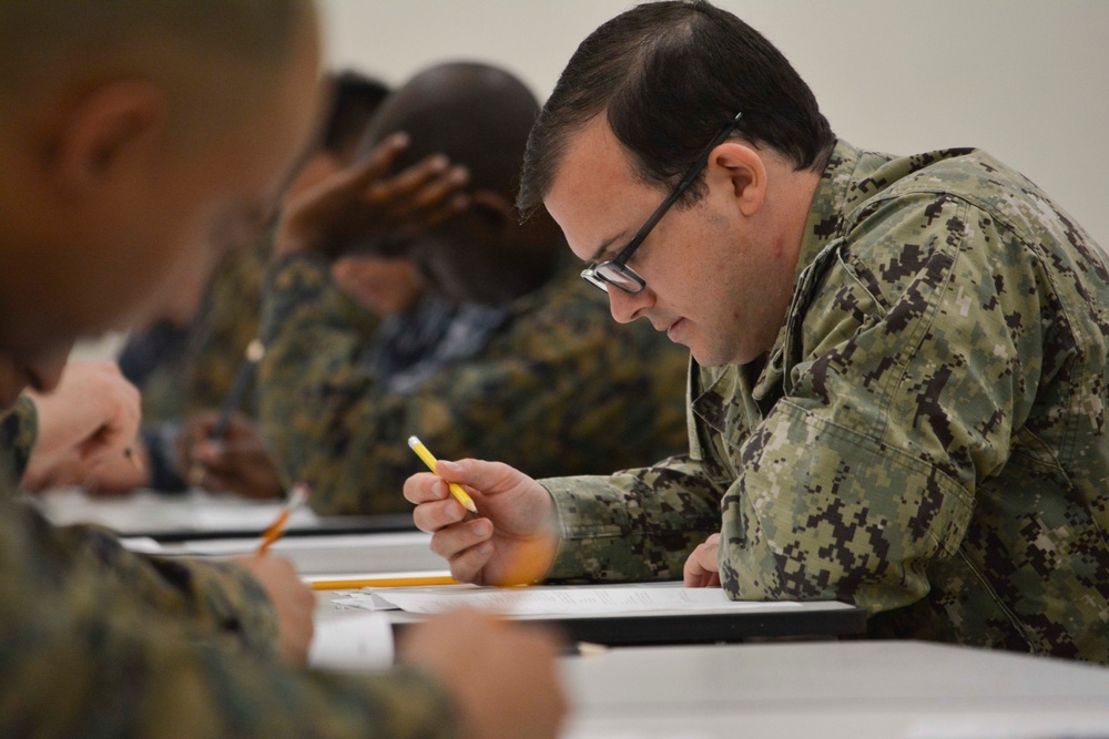 A reserve Sailor assigned to Navy Operational Support Center (NOSC) Los Angeles participates in the January E-4 to E-7 advancement exams in the drill hall at NOSC Los Angeles