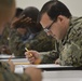 A reserve Sailor assigned to Navy Operational Support Center (NOSC) Los Angeles participates in the January E-4 to E-7 advancement exams in the drill hall at NOSC Los Angeles
