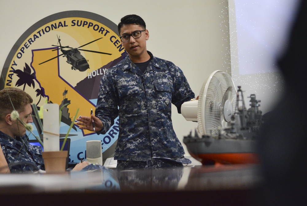 Yeoman 2nd Class Arturo Magallanes, assigned to Navy Operational Support Center (NOSC) Los Angeles, speaks to Reserve Sailors assigned to the Greater Los Angeles Area at command indoctrination during drill weekend