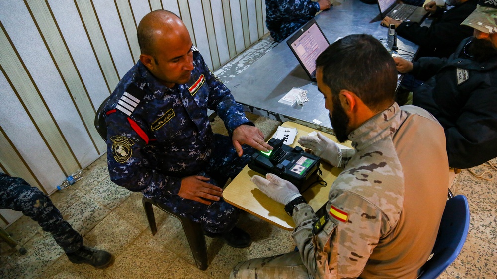 Iraqi Federal Police  enroll their biometrics into a database