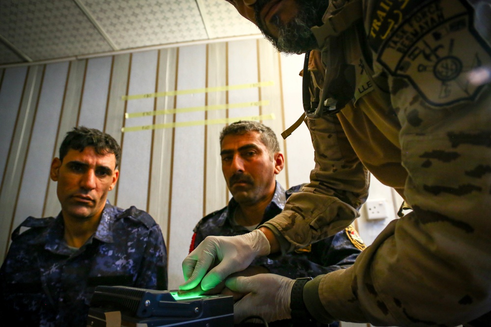 Iraqi Federal Police  enroll their biometrics into a database