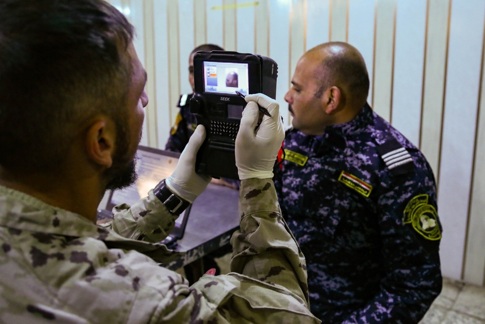 Iraqi Federal Police  enroll their biometrics into a database