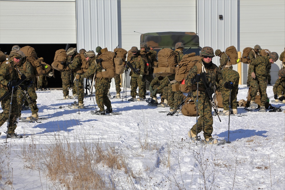 Cold-Weather Operations Course students prepare for snowshoe training