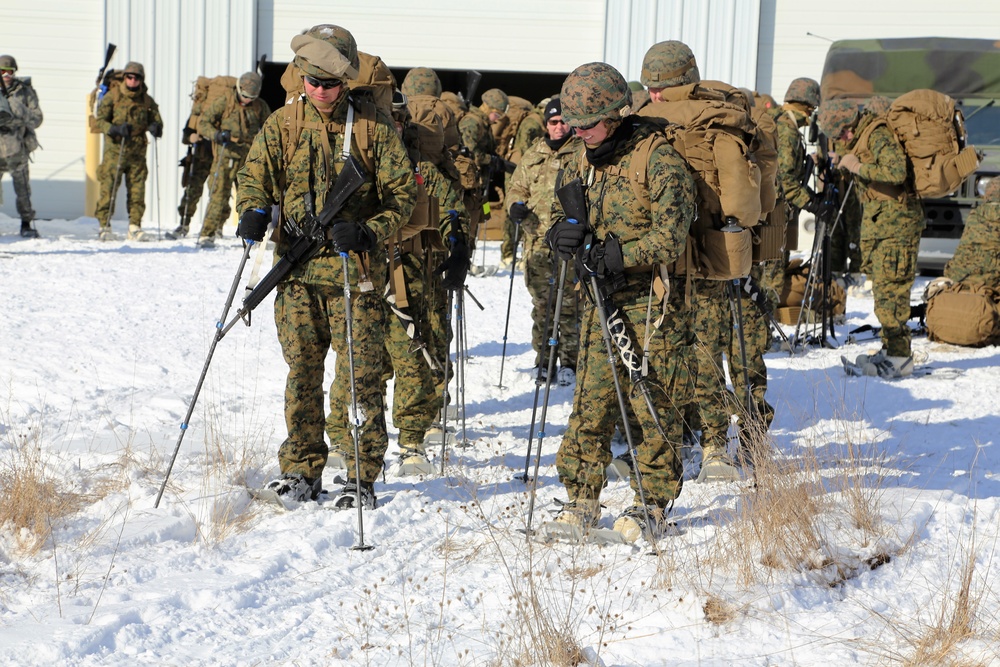 Cold-Weather Operations Course students prepare for snowshoe training