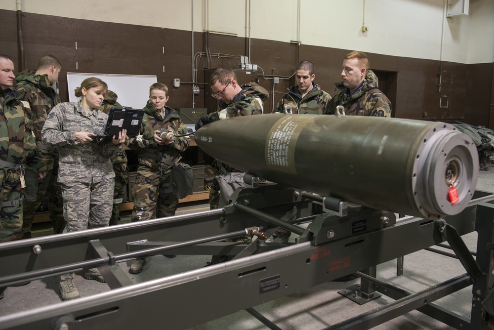 477th Maintenance Squadron Airmen practice bomb building in a simulated toxic environment