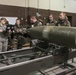 477th Maintenance Squadron Airmen practice bomb building in a simulated toxic environment