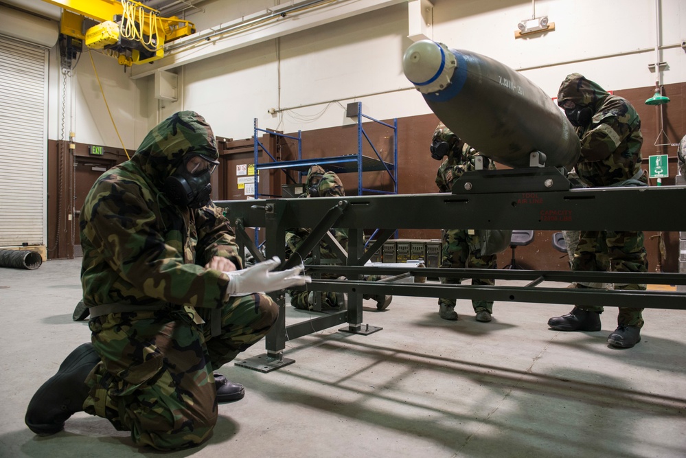 477th Maintenance Squadron Airmen practice bomb building in a simulated toxic environment