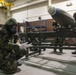 477th Maintenance Squadron Airmen practice bomb building in a simulated toxic environment