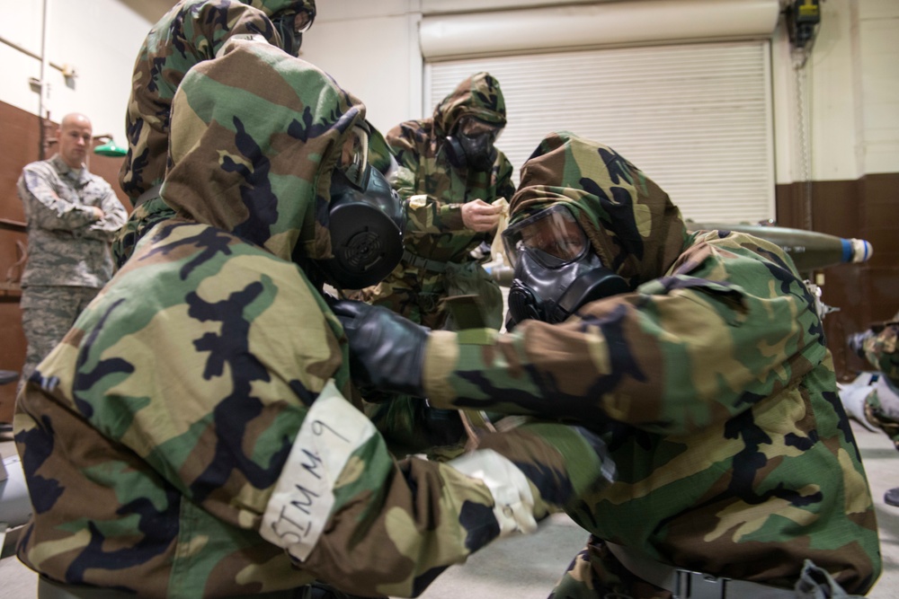 477th Maintenance Squadron Airmen practice bomb building in a simulated toxic environment