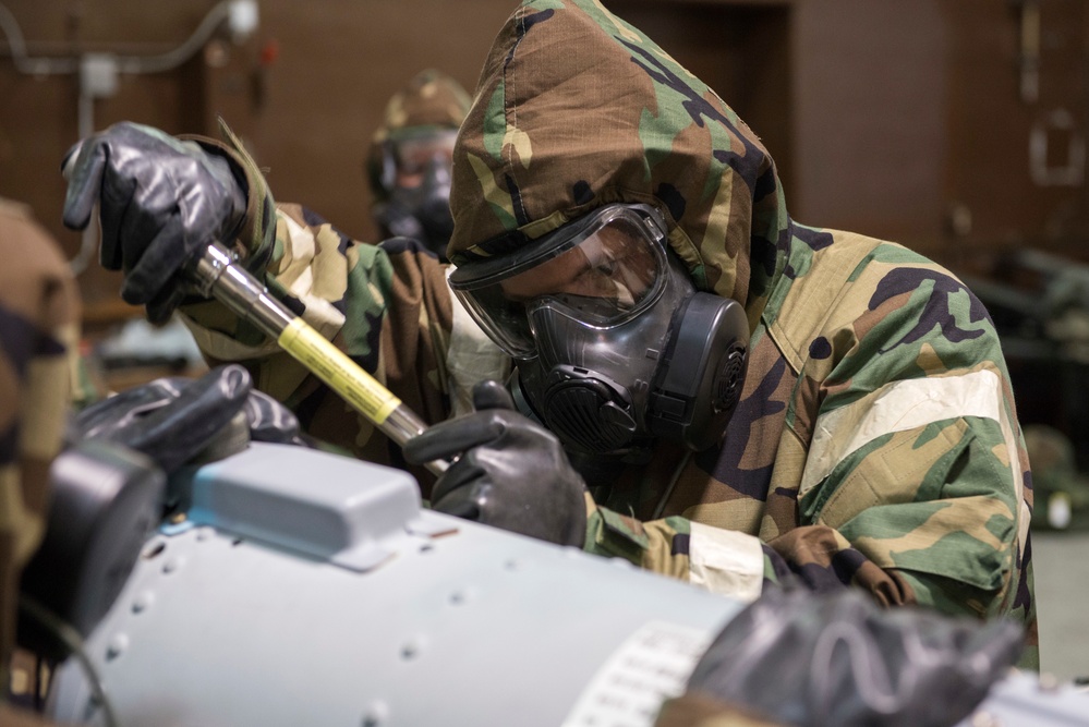 477th Maintenance Squadron Airmen practice bomb building in a simulated toxic environment