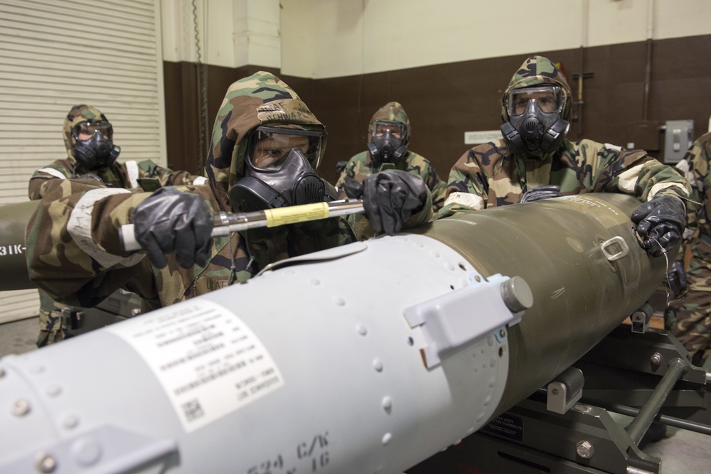 477th Maintenance Squadron Airmen practice bomb building in a simulated toxic environment