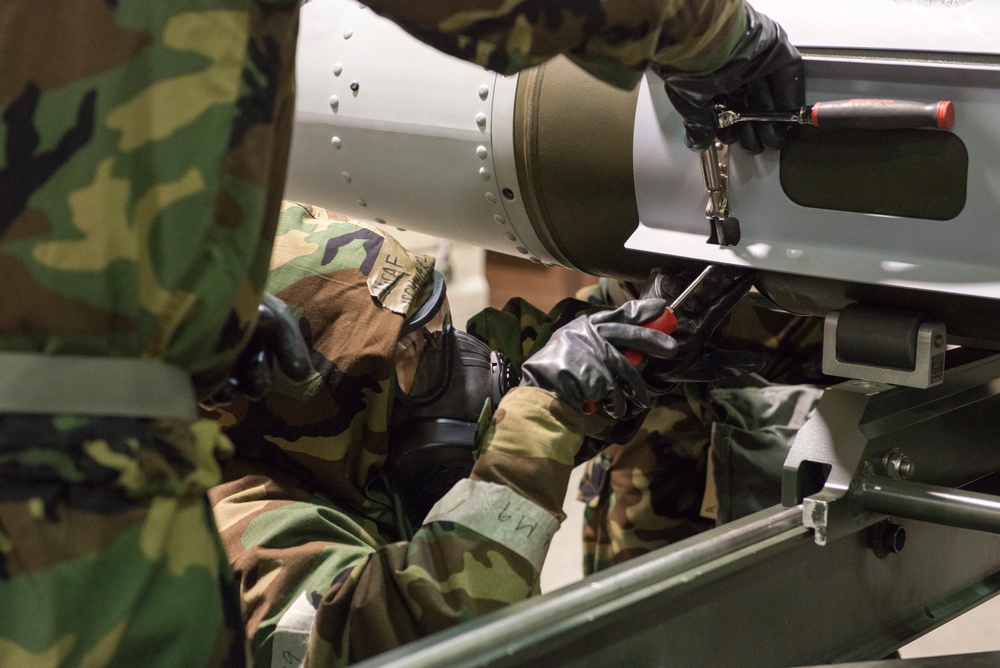 477th Maintenance Squadron Airmen practice bomb building in a simulated toxic environment