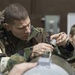 477th Maintenance Squadron Airmen practice bomb building in a simulated toxic environment