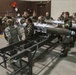 477th Maintenance Squadron Airmen practice bomb building in a simulated toxic environment