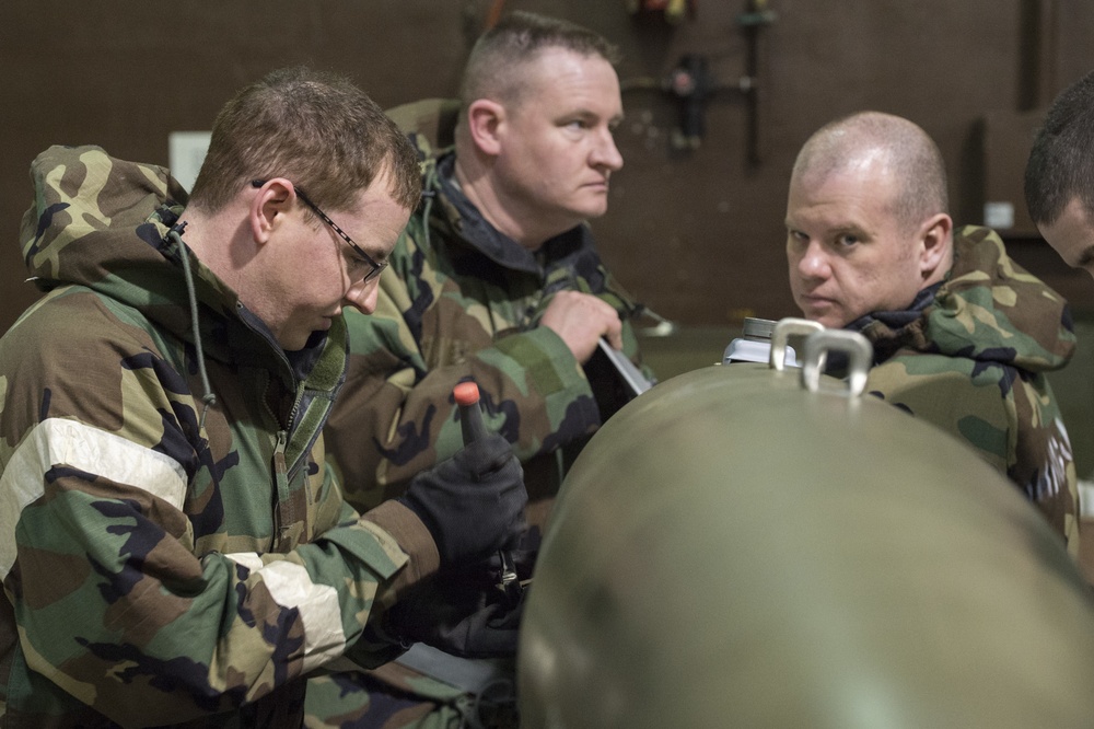 477th Maintenance Squadron Airmen practice bomb building in a simulated toxic environment