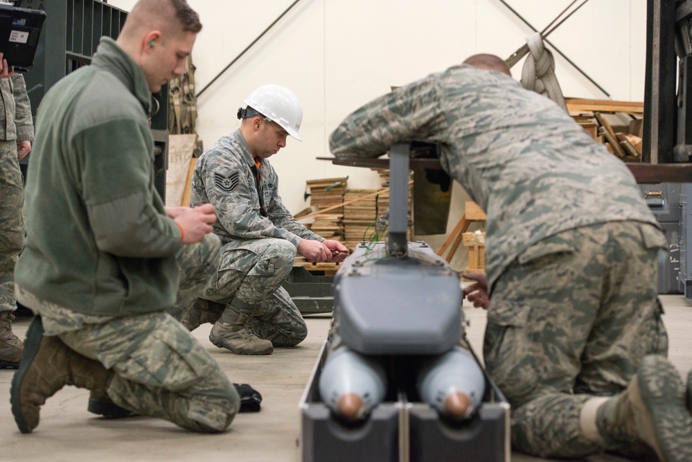 3rd Munitions Squadron Airmen practice handling small diameter bombs