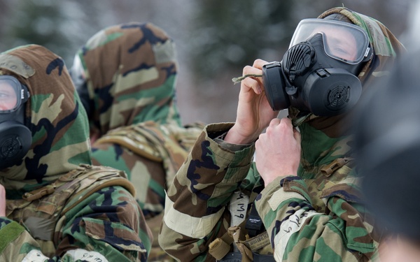 Explosives Ordinance Disposal Airmen conduct live-fire range in simulated chemical environment