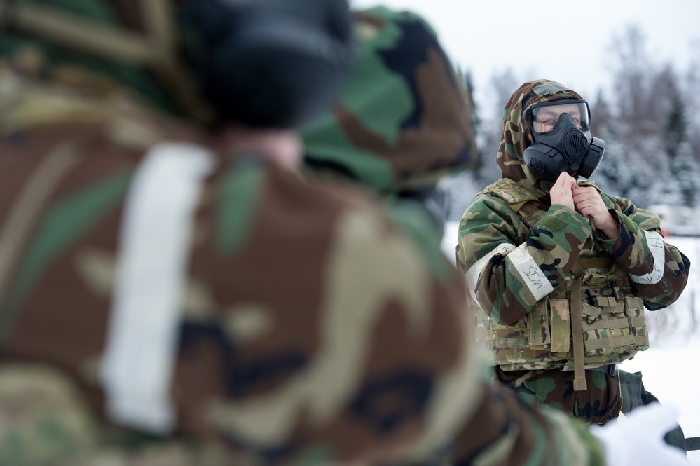 Explosives Ordinance Disposal Airmen conduct live-fire range in simulated chemical environment