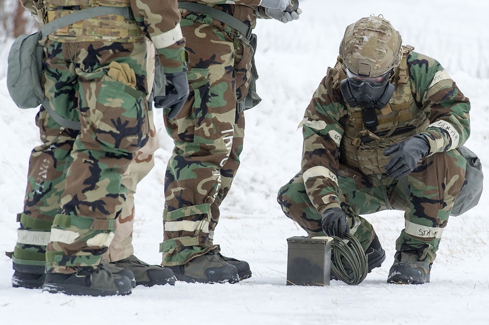 Explosives Ordinance Disposal Airmen conduct live-fire range in simulated chemical environment