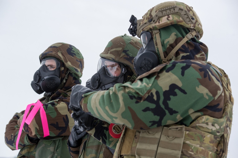 Explosives Ordinance Disposal Airmen conduct live-fire range in simulated chemical environment