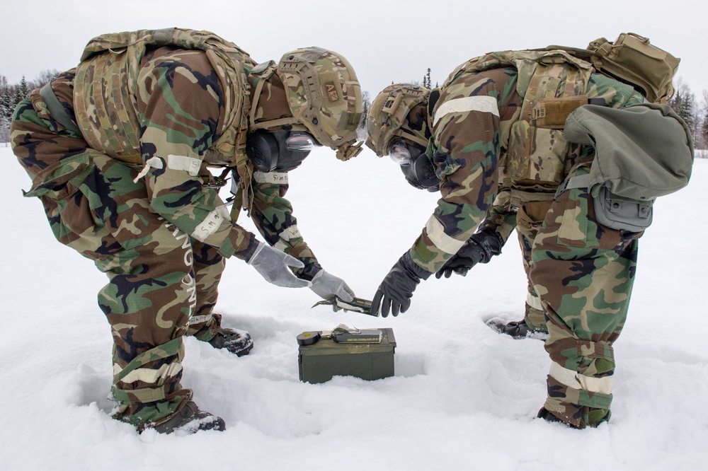 Explosives Ordinance Disposal Airmen conduct live-fire range in simulated chemical environment