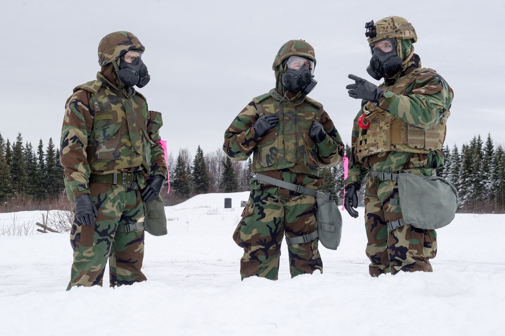 Explosives Ordinance Disposal Airmen conduct live-fire range in simulated chemical environment